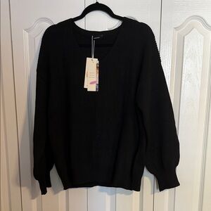 Elegant Black V-Neck Sweater by [Brand]